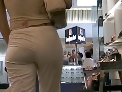 Sweet chick with big butt jeans is in the shoe shop having no clue to be spied on cam